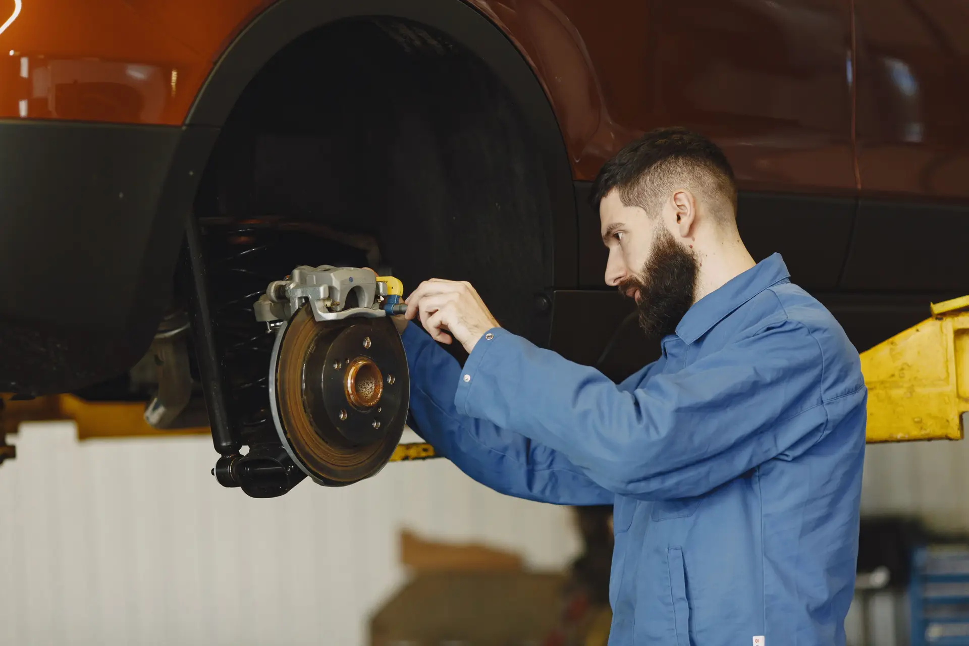 Mechanic performing brake repair